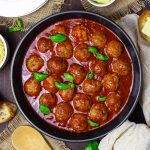 Overhead of meatballs in sauce in pan square image