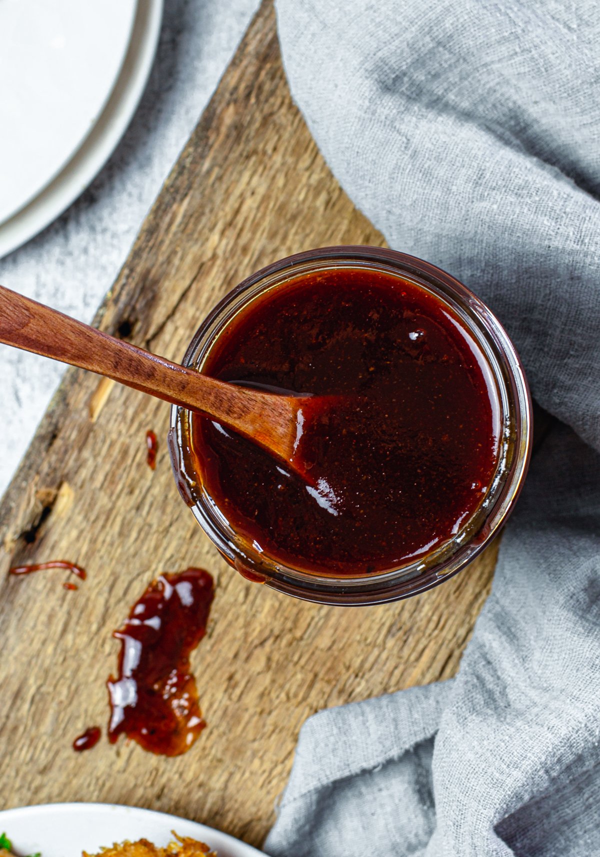 Overhead of Homemade BBQ Sauce Recipe with spoon in jar