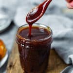 Spoon dripping Homemade BBQ Sauce Recipe in jar