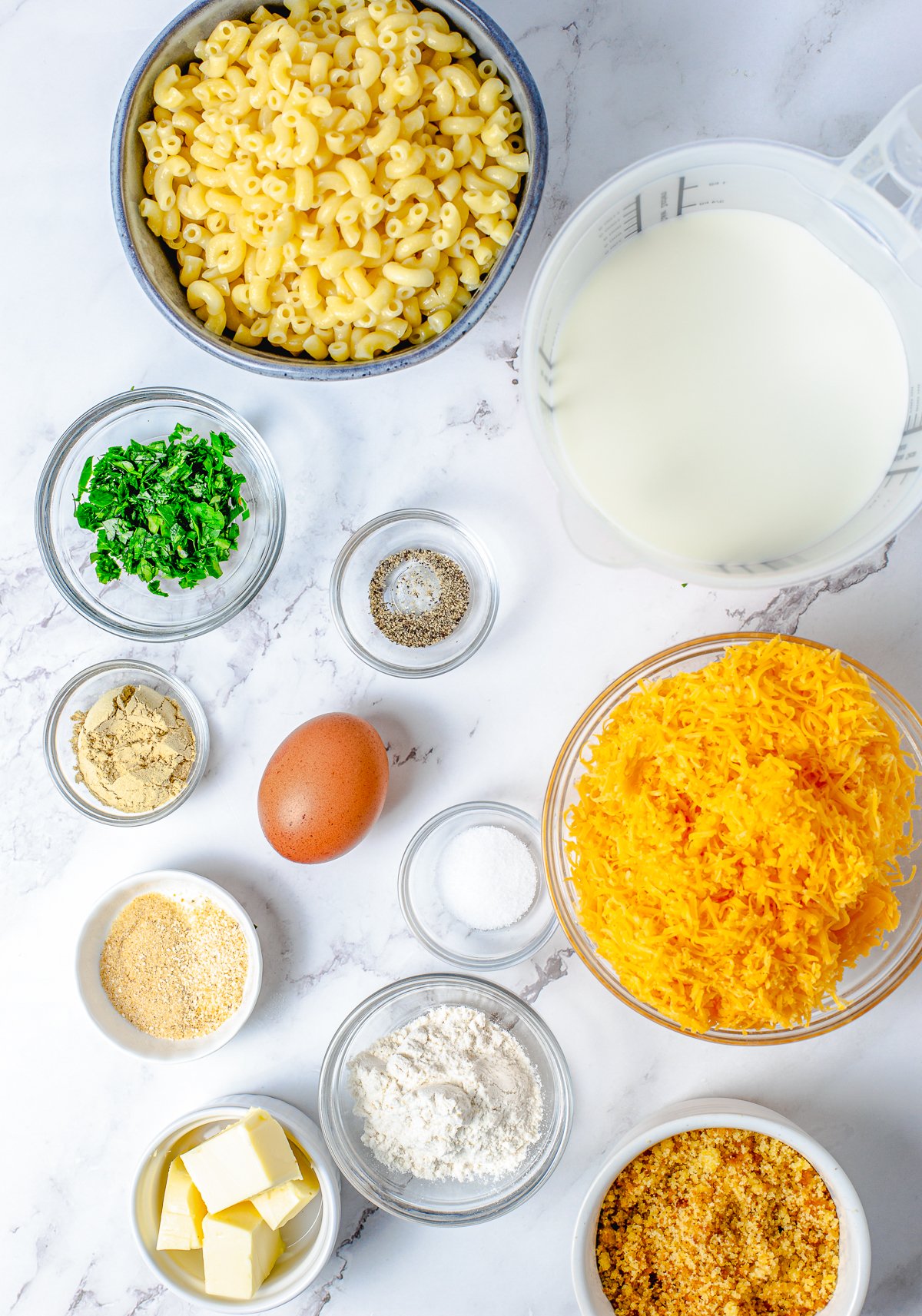 Ingredients needed to make Baked Macaroni and Cheese.