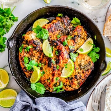 Square image of finished chicken in skillet.