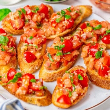 Bruschetta with fresh tomatoes and basil served on garlic crostini.
