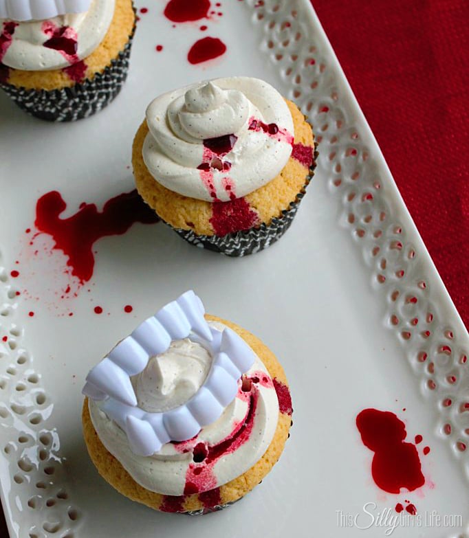 Vampire Kiss Cupcakes made from Vanilla Cupcakes with Vanilla Bean Buttercream recipe on https://ThisSillyGirlsLife.com #VampireCupcake #HalloweenTreats #VanillaCupcake #Vanilla #Buttercream