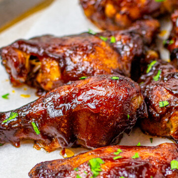 Close up of pieces of chicken topped with parsley