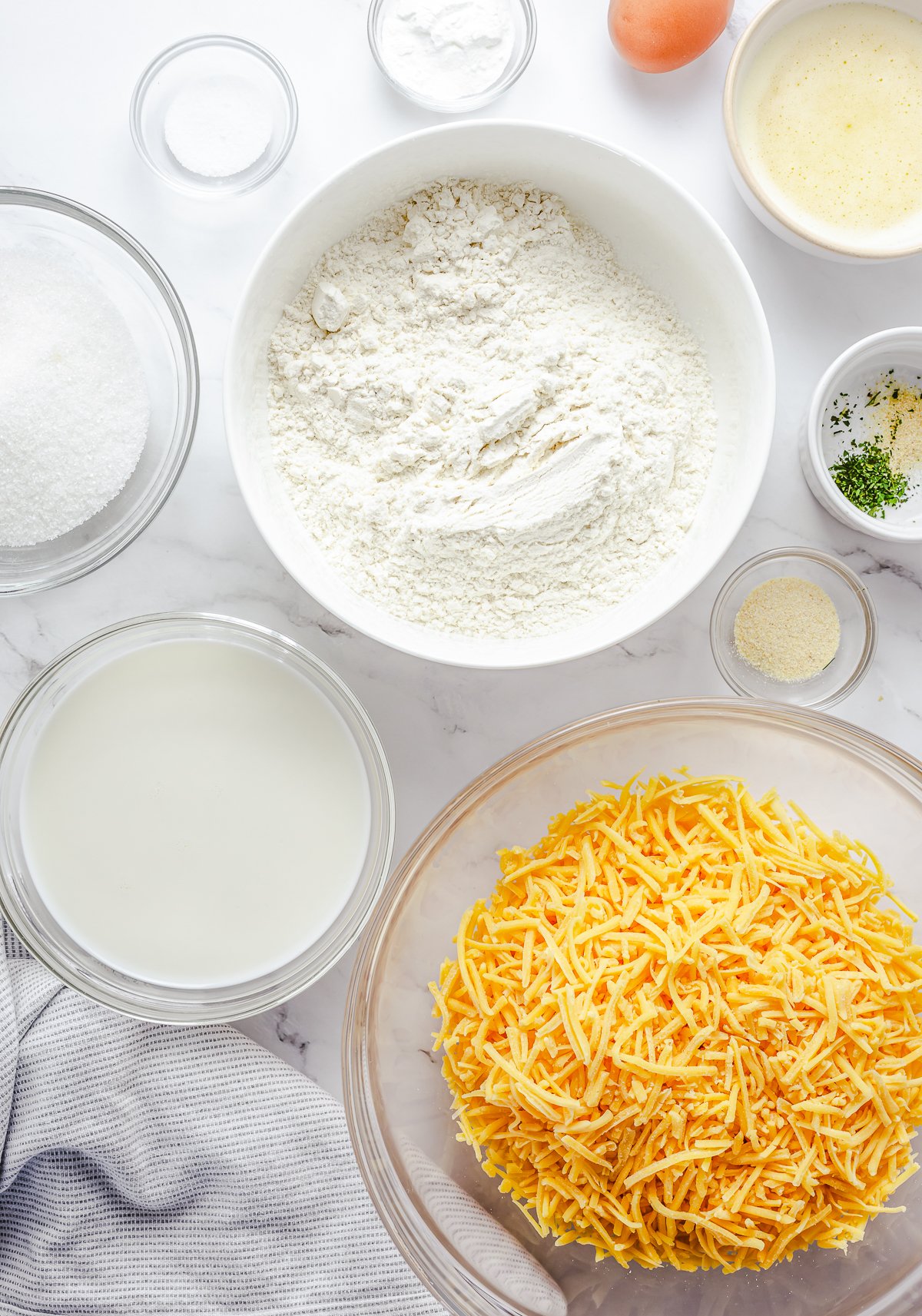 Ingredients needed to make Garlic Cheese Muffins.