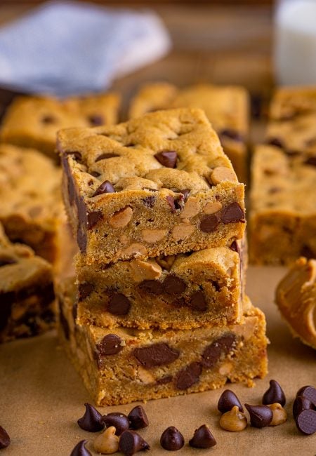 Three stacked Peanut Butter Chocolate Chip Cookie Bars.