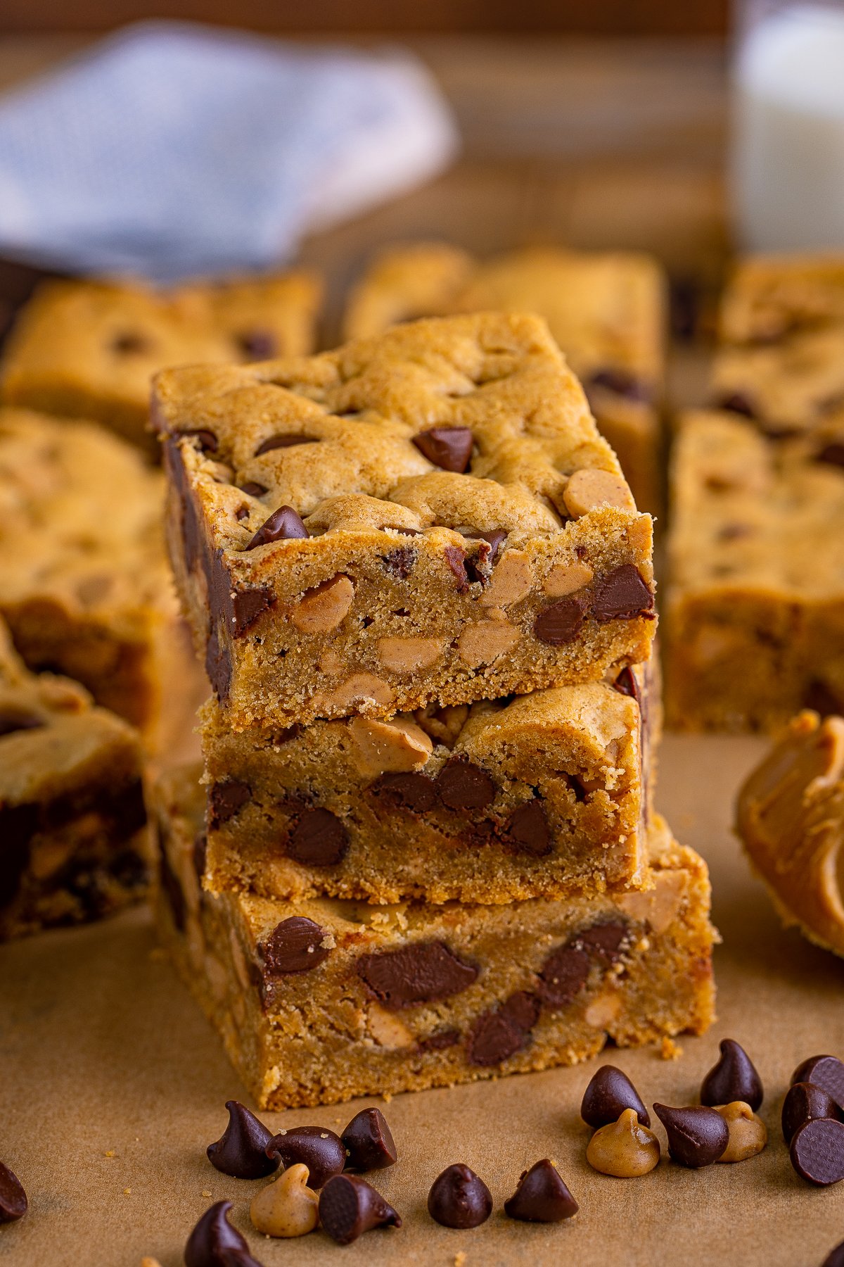 Three stacked Peanut Butter Chocolate Chip Cookie Bars.