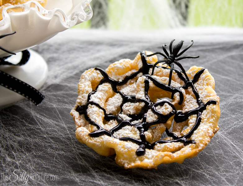 Crispy Spider Webs {Mini Funnel Cakes} perfect for a Halloween party or a treat before the little ones go trick or treating! Recipe from https://ThisSillyGirlsLife.com #Halloween #SpiderWeb #SpiderTreats #FunnelCakes #Mini