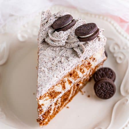 Overhead of a slice of the Zebra Cake Recipe on white plate showing the topping.
