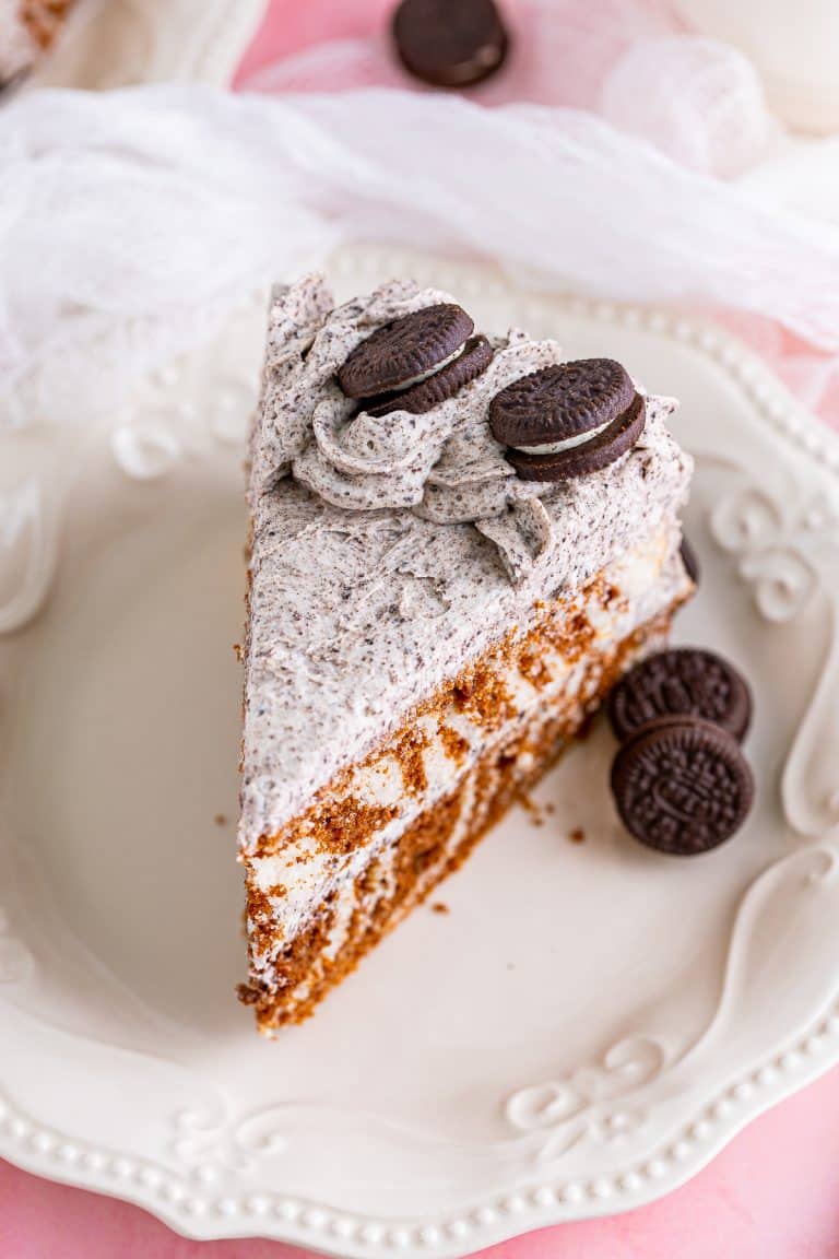 Overhead of a slice of the Zebra Cake Recipe on white plate showing the topping.