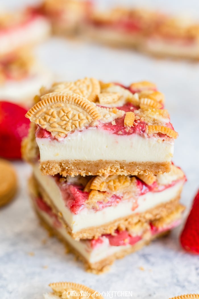 Strawberry Cheesecake Bars stacked on top of one another