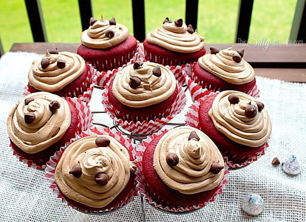 Chocolate Stuffed Red Velvet Cupcakes with Nutella Frosting, stuffed with a little Hershey's kiss and topped with buttercream flavored with nutella... woah!