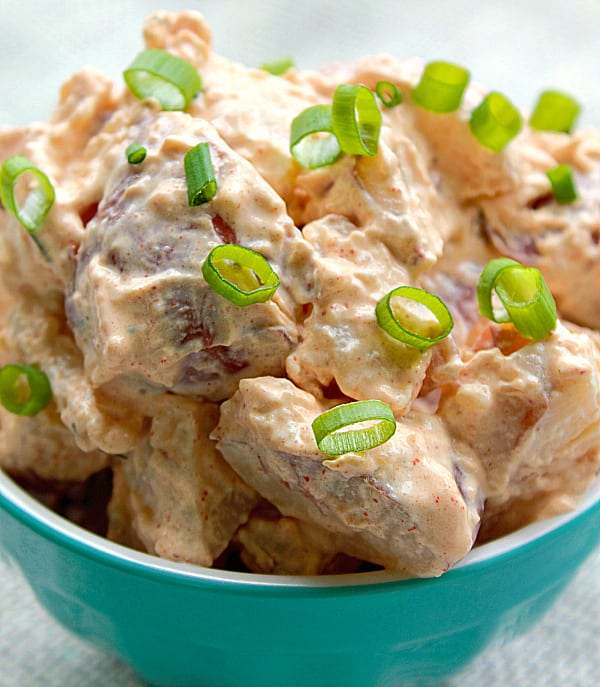 Paprika Sour Cream Red Potato Salad, cool and creamy, with hints of dill, paprika and topped with fresh green onions, yummy!