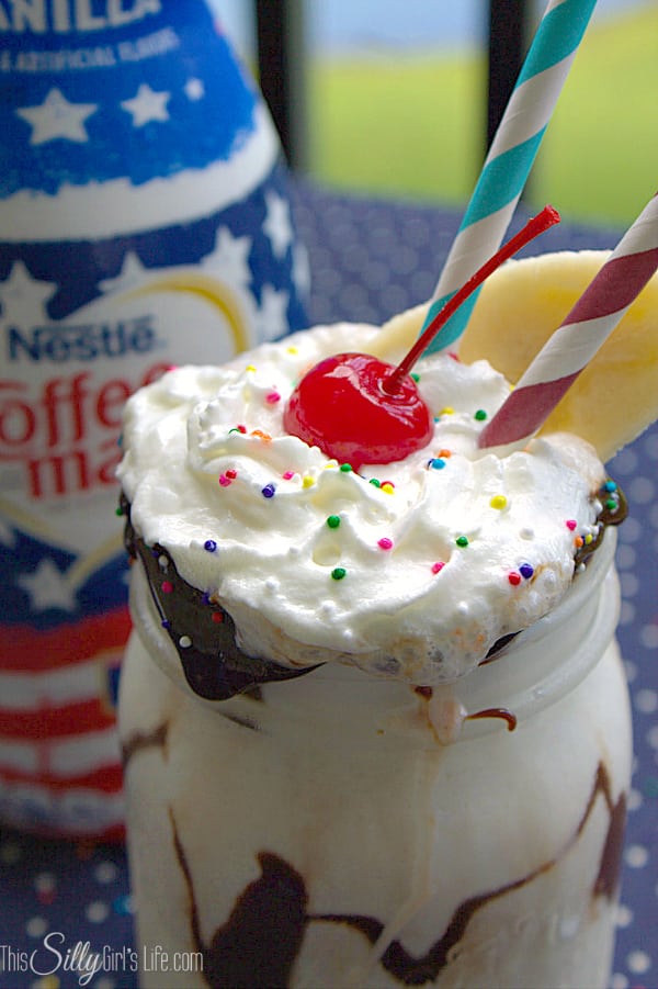 Banana Split Milkshake, vanilla ice cream mixed with fresh bananas, Coffe-Mate french vanilla creamer and whipped cream. Topped with hot fudge, whipped cream, sprinkles, banana slice and a cherry on top! #CMSalutingHeroes #shop