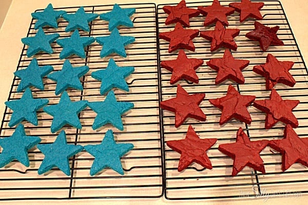 Let cool on wired rack until completely cooled. Using a medium star cookie cutter, cut out star shapes. Try to get them as close together as possible, you should be able to get 15 stars from each color. Cut dough with cutter, wiggle cutter to loosen brownie from bottom of pan. Brownie should lift off with cutter, carefully place brownie on wired rack or surface of you choice until ready to frost. 