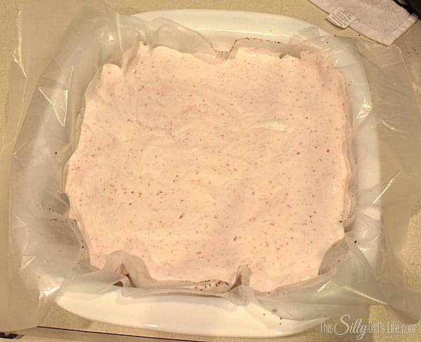 Fold in the whipped topping. Pour on top of the crushed cookies and place in freezer until set about 5-6 hours.