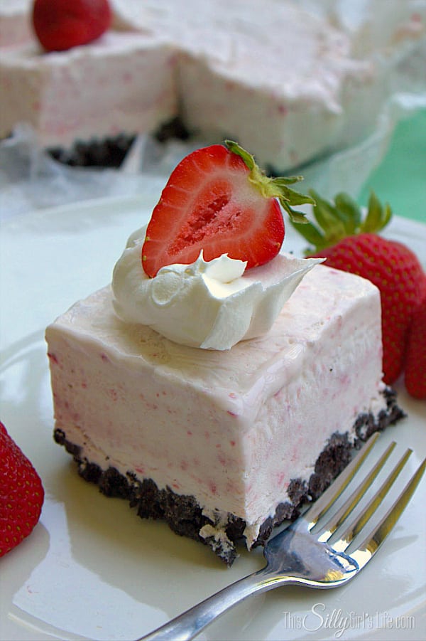 Chocolate Covered Strawberry Icebox Bars, fresh strawberry puree mixed with cream cheese, poured over crushed oreos and frozen for a perfect summer dessert!