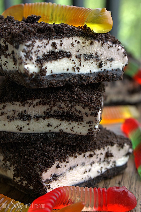 Frozen Dirt Cake Bars, Oreo crumb crust, layers of sweetened cream cheese, more Oreo crumbs and gummi worms, this is sure to be a new household favorite!