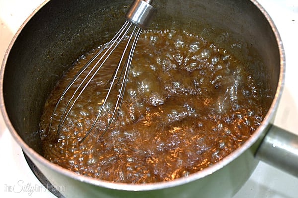You can make the glaze while cooking the chicken. Place the vegetable oil into a small sauce pot over medium heat. Add in garlic until fragrant about 30 seconds, do not allow garlic to brown. Add in soy sauce immediately along with the remaining ingredients. With a whisk, whisk the brown sugar so it dissolves and allow to come to a simmer. Simmer sauce until thickened to a syrup consistency, this will take about 10 minutes but keep an eye on it so it doesn't burn, stirring every minute or so. When simmering, it WILL bubble up from the sugar, do not be alarmed. 