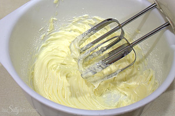 Place butter and powdered sugar in a large bowl. Using a hand mixer, whip to combine on low speed. 