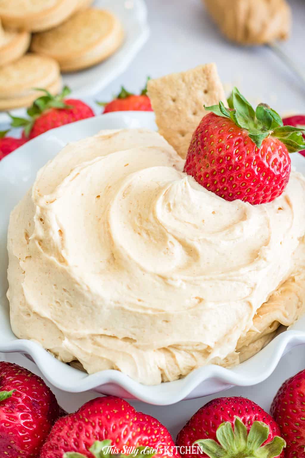 Close up of Fluffernutter Dip in bowl with strawberry 