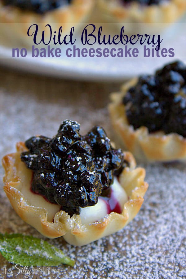 Wild Blueberry No Bake Cheesecake Bites, cheesecake filling piped in mini phyllo cups and topped with wild blueberry sauce. - ThisSillyGirlsLife.com