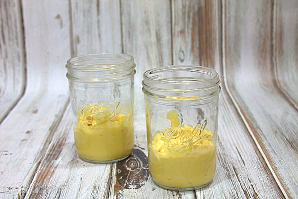 If making mason jar trifles as pictured, layer half of the pudding in the bottom of each jar. 