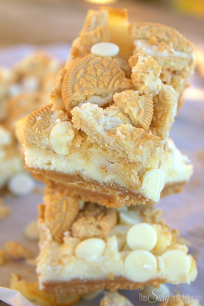 Golden Oreo White Chocolate Cheesecake Bars, golden Oreo crust with a smooth cheesecake filling studded with white chocolate chips! - ThisSillyGirlsLife.com