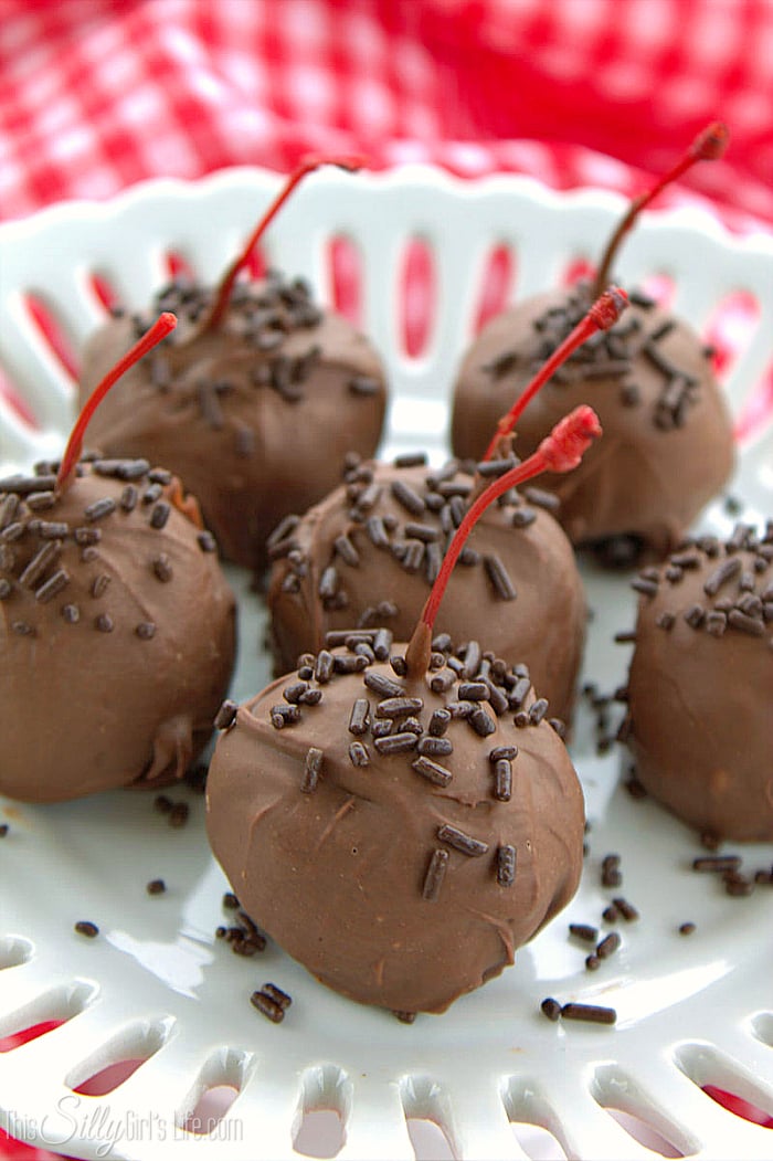 Chocolate Covered Cherry Oreo Cookie Balls, maraschino cherries stuffed inside a classic Oreo cookie ball and dipped in melted chocolate! - ThisSillyGirlsLife.com