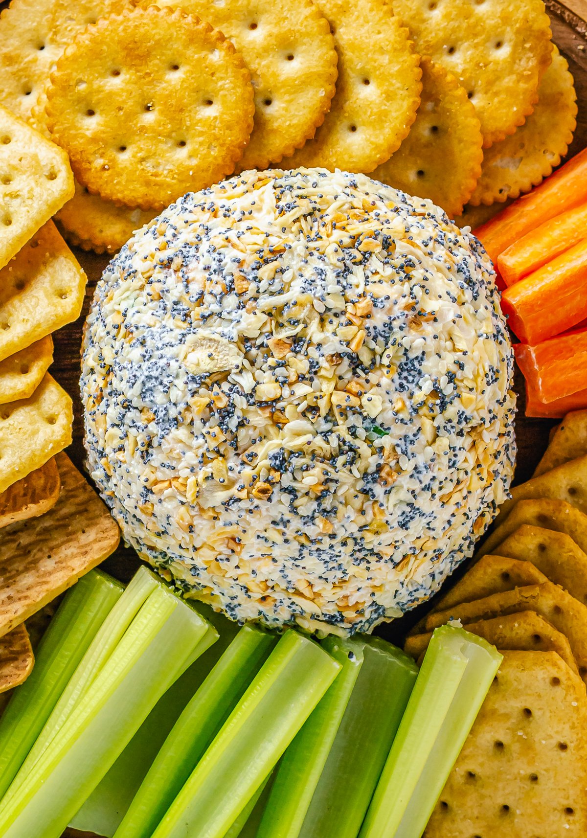 Overhead image of finished Cheese Ball Recipe surrounded by dippers.