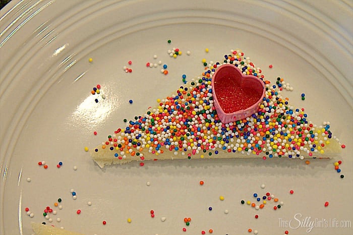 Cupid Fairy Bread, white bread smeared with homemade honey butter and topped with sprinkles for a yummy Valentine's day snack! - ThisSillyGirlsLife.com #ValentinesDayDesserts #FairyBread