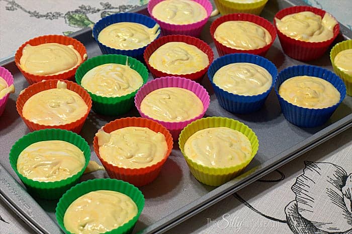 Orange Creamsicle Pie filling divided among colorful silicone baking cups.