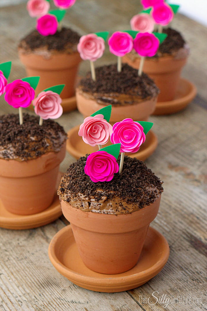 Flowerpot Cupcakes, chocolate devil's food cake baked in mini terracotta flower pots, topped with frosting, Oreo crumbs and pretty paper flowers to mimic flowerpots! - ThisSillyGirlsLife.com #FlowerpotCupcakes