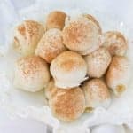 A plate of tiramisu balls dusted with cocoa powder.