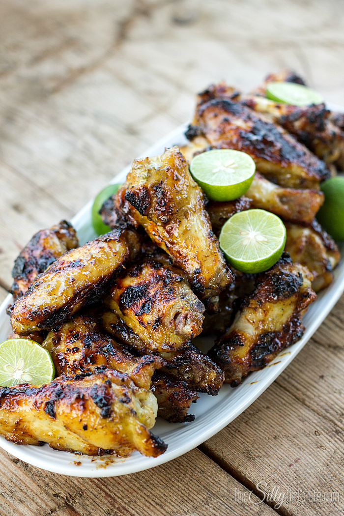 Grilled Key Lime Chicken Wings, marinaded for hours in a sweet, herbaceous marinade with a hint of key lime, then grilled to caramelized perfection! Plus video tutorial. - ThisSillyGirlsLife.com #chickenwings #gilling #keylime
