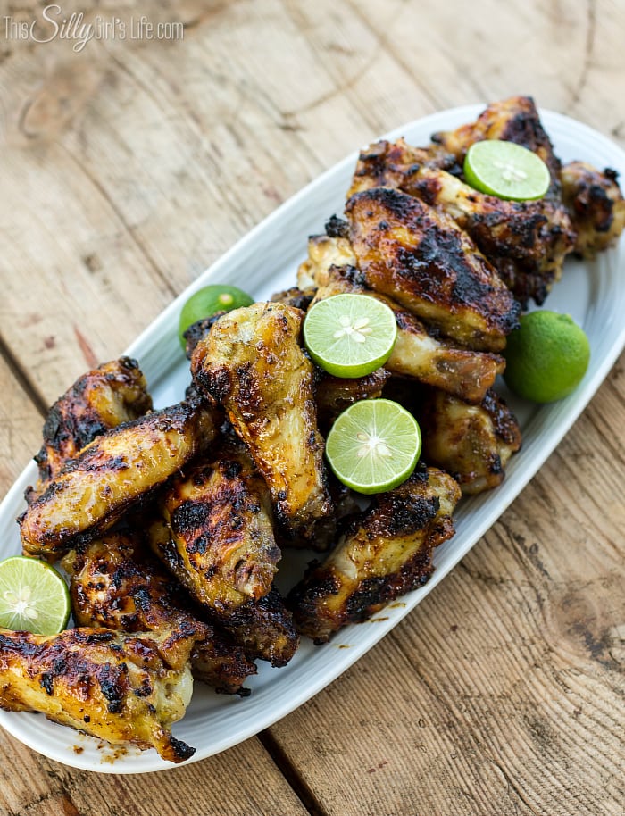 Grilled Key Lime Chicken Wings, marinaded for hours in a sweet, herbaceous marinade with a hint of key lime, then grilled to caramelized perfection! Plus video tutorial. - ThisSillyGirlsLife.com #chickenwings #gilling #keylime