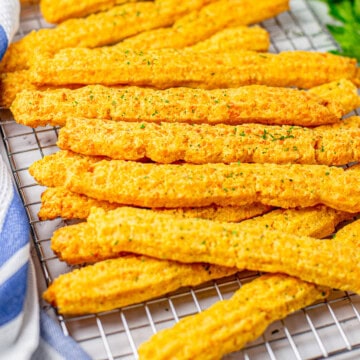 Square image of Cheese Straws on wire rack