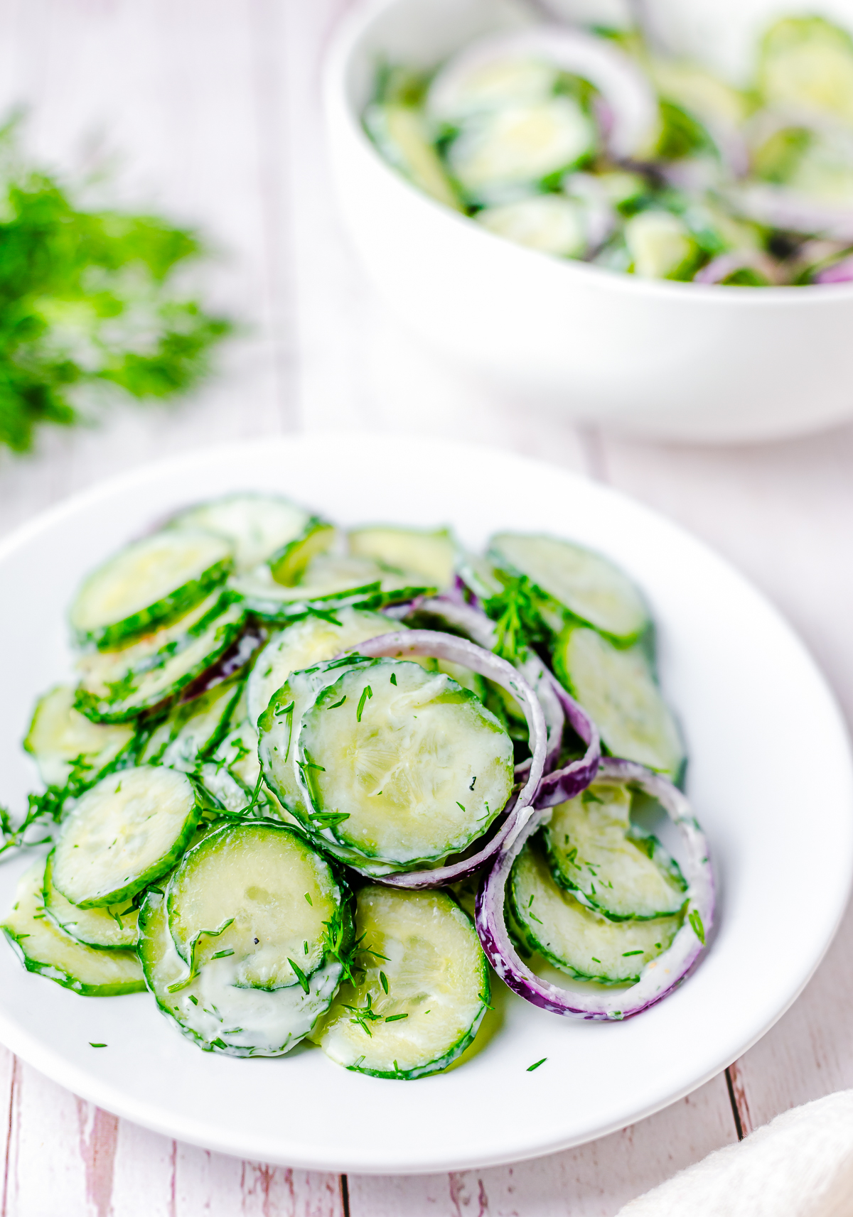 Dill Cucumber Salad on white plate
