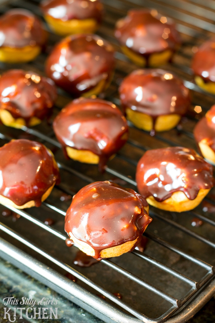 Baked Chocolate Glazed Pumpkin Donut Holes, bite sized pumpkin donuts dipped in chocolate ganache! from ThisSillyGirlsLife.com #pumpkindonuts #chocolateganache #fall