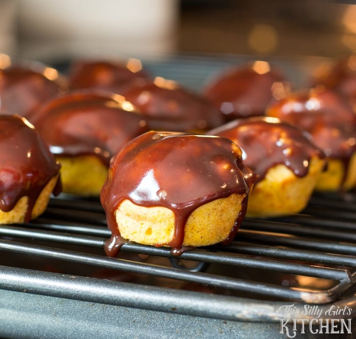 Baked Chocolate Glazed Pumpkin Donut Holes, bite sized pumpkin donuts dipped in chocolate ganache!