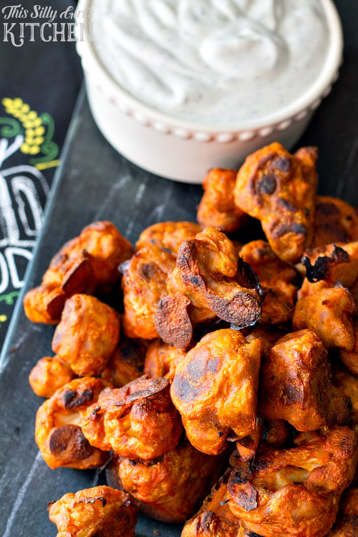 Cauliflower Buffalo Wings with Vegan Ranch Dip, a guilt free and vegan version of the popular Football snack! Perfect for #MeatlessMondayNight from ThisSillyGirlsLife.com #ad