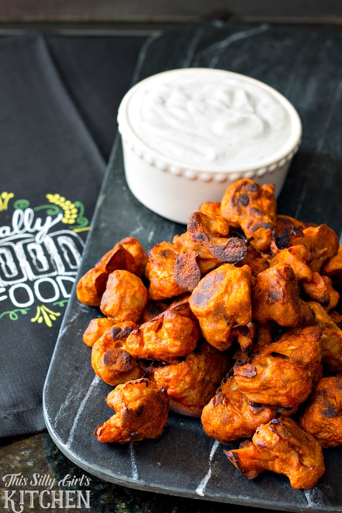 Cauliflower Buffalo Wings with Vegan Ranch Dip, a guilt free and vegan version of the popular Football snack! Perfect for #MeatlessMondayNight from ThisSillyGirlsLife.com #ad