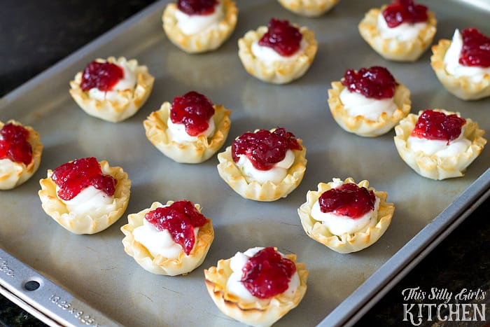 Creamy Cranberry Pancetta Bites, flavored goat cheese in phyllo cups with whole berry cranberry sauce and crispy pancetta! from ThisSillyGirlsLife.com #thanksgiving