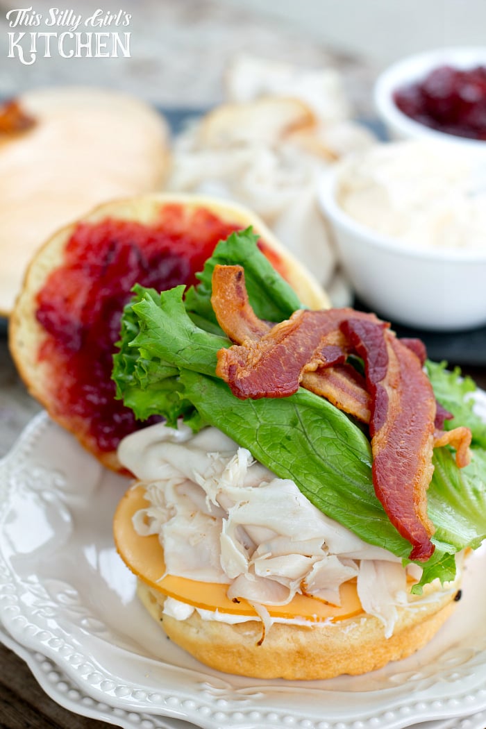 Ultimate Turkey Bacon Cranberry Sandwich, an amazing sandwich on a toasted onion roll, featuring cranberry sauce, smoked Gouda, turkey and of course, BACON... perfect for game day! from ThisSillyGirlsLife.com #CBCTailgating #tailgatingrecipes #homegating #tailgating #ad