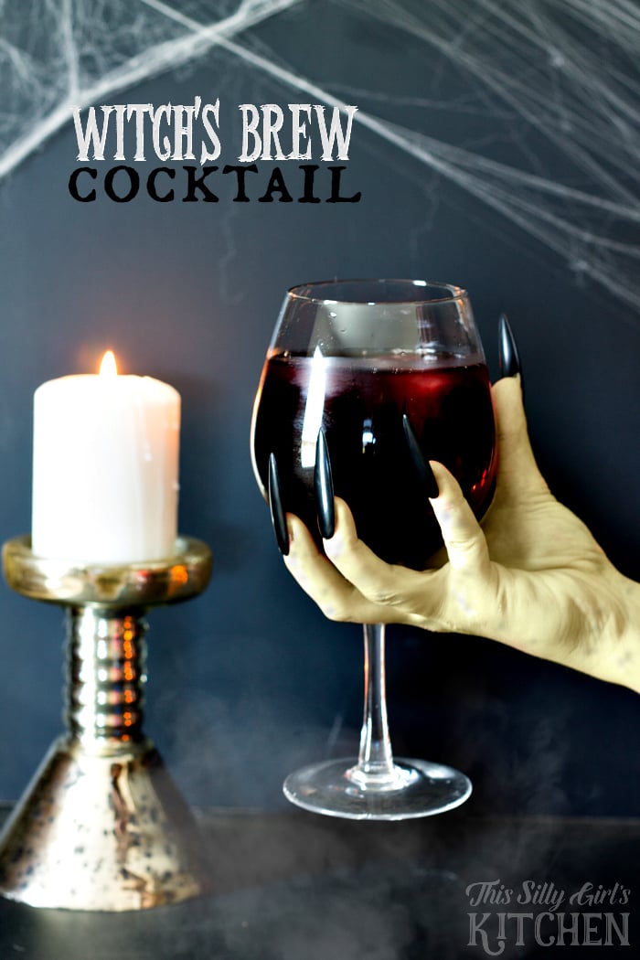 Witch's Brew Cocktail, do you dare to try this bewitching cocktail? It's delicious, I promise, just one little sip! Glacier Berry Lemonade, whipped cream vodka and my fruity twist... cranberry juice ice cubes! from ThisSillyGirlsLife.com #mikesVIP #ad @mikeshard