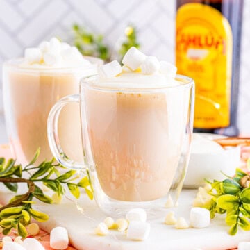 Square image of White Hot Chocolate in two clear mugs.