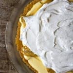 A whole Banana Pudding Pie topped with whipped cream and caramelized bananas.