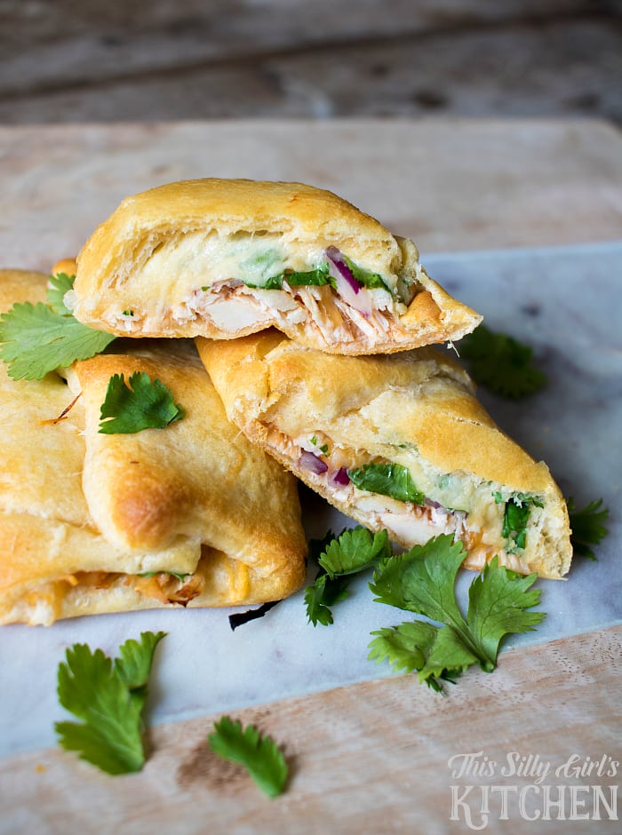 BBQ Chicken Pizza Crescent Rolls, crescent rolls stuffed with bbq chicken, red onion, cilantro and of course... CHEESE!! from ThisSillyGirlsLife.com