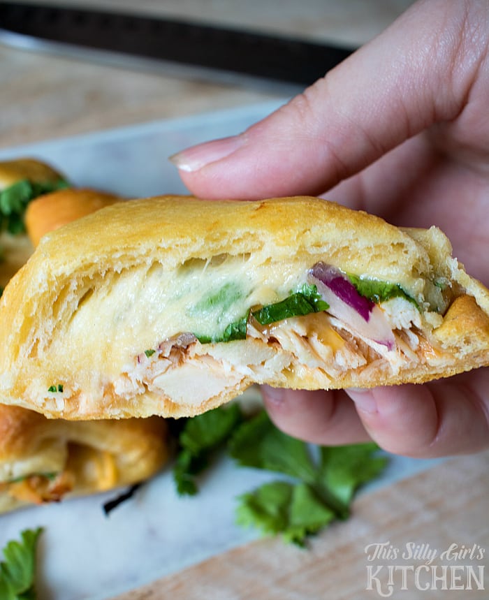BBQ Chicken Pizza Crescent Rolls, crescent rolls stuffed with bbq chicken, red onion, cilantro and of course... CHEESE!! from ThisSillyGirlsLife.com
