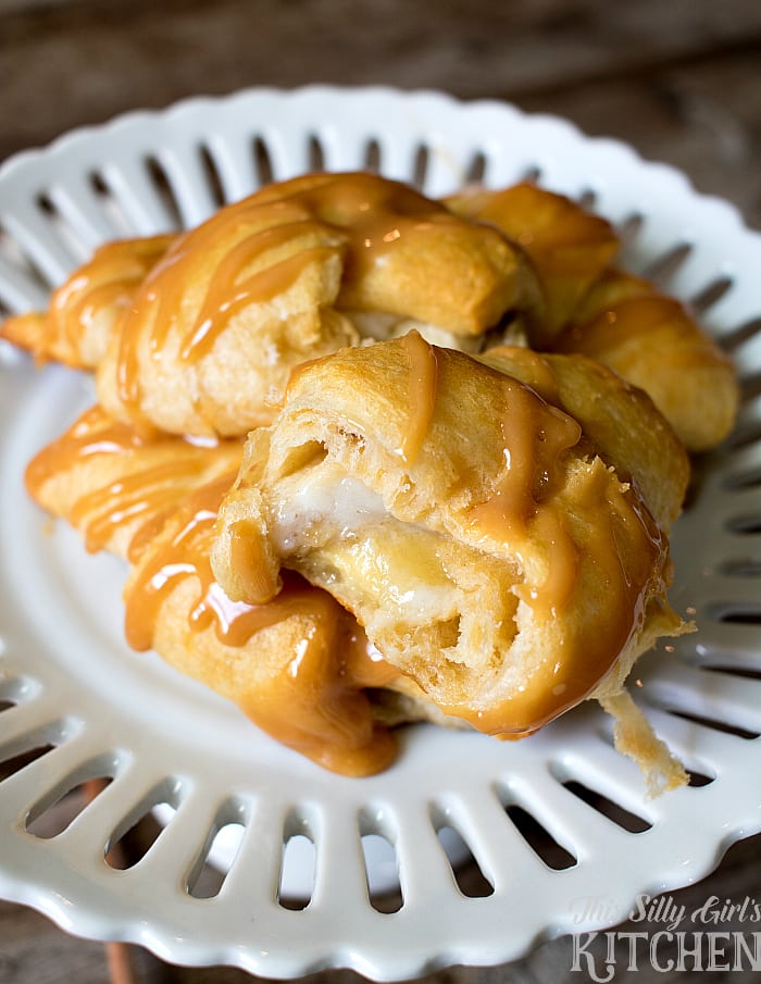Caramel Banana Cream Sweet Rolls, bananas and cream cheese icing rolled in crescent roll dough, baked until golden brown and topped with caramel sauce! from ThisSillyGirlsLife.com